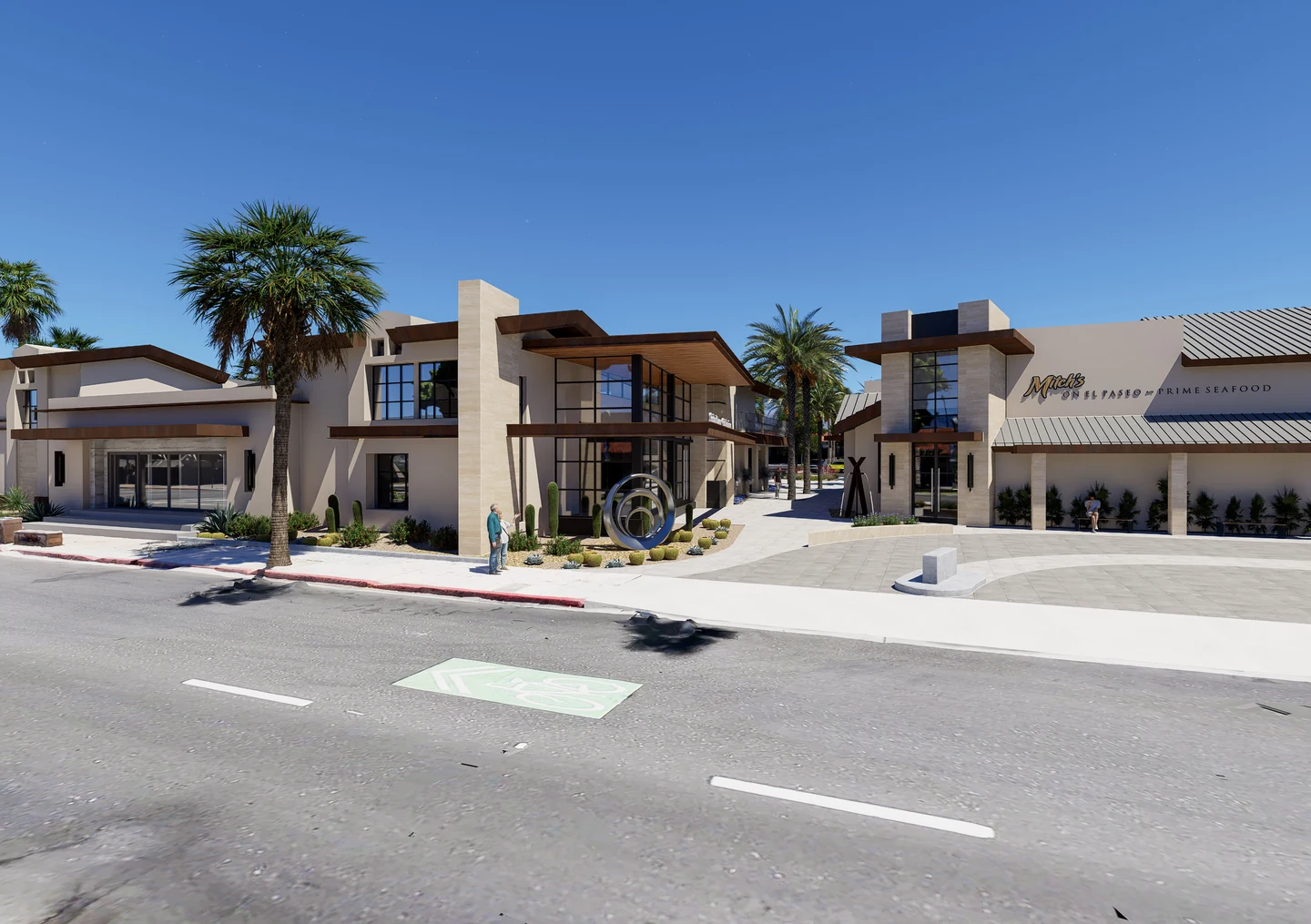 A street view of contemporary commercial buildings with broad roof overhangs, palm trees, a pedestrian passage, and a circular sculpture.